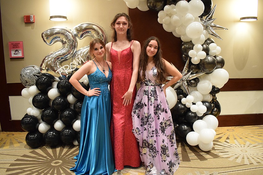 Juniors Alison Swarz, Robert Zabriskie and Danielle Bernate pose for a prom photo.