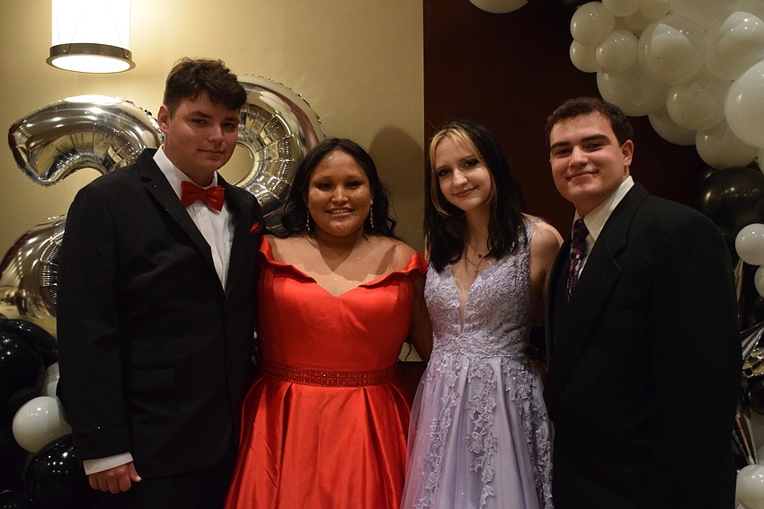 Seniors Kaden Castano, Lori Smalley, Katherine Thomas and Anderson Lugo pose for a prom photo.
