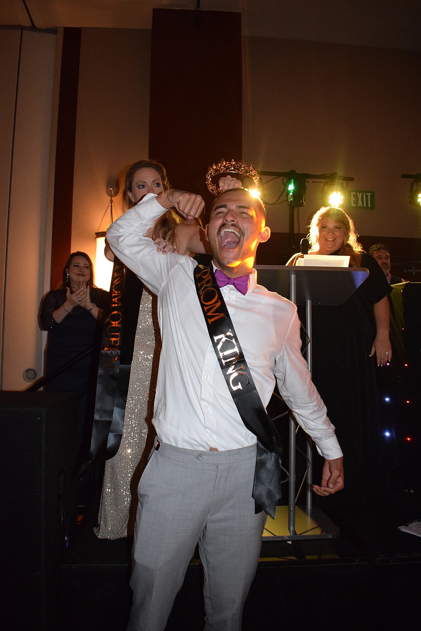 Senior David Kochaniec celebrates being named prom king.