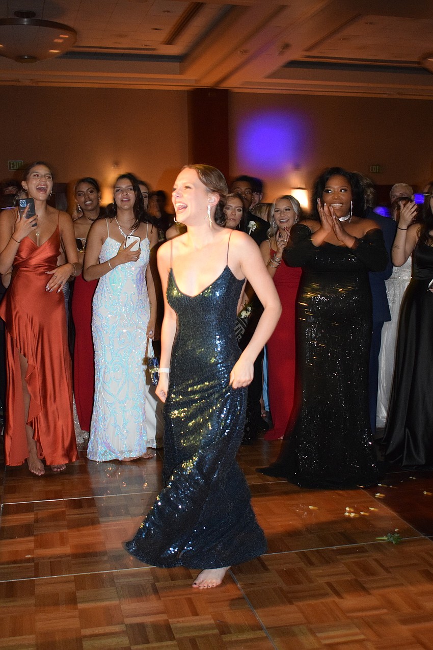 Students chant senior Jacsyn Hockenbury's name after she is announced as prom queen.