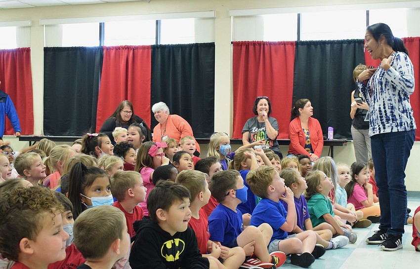 Josephine Johnson, a kindergarten teacher, asks her class where she should kiss the pig.
