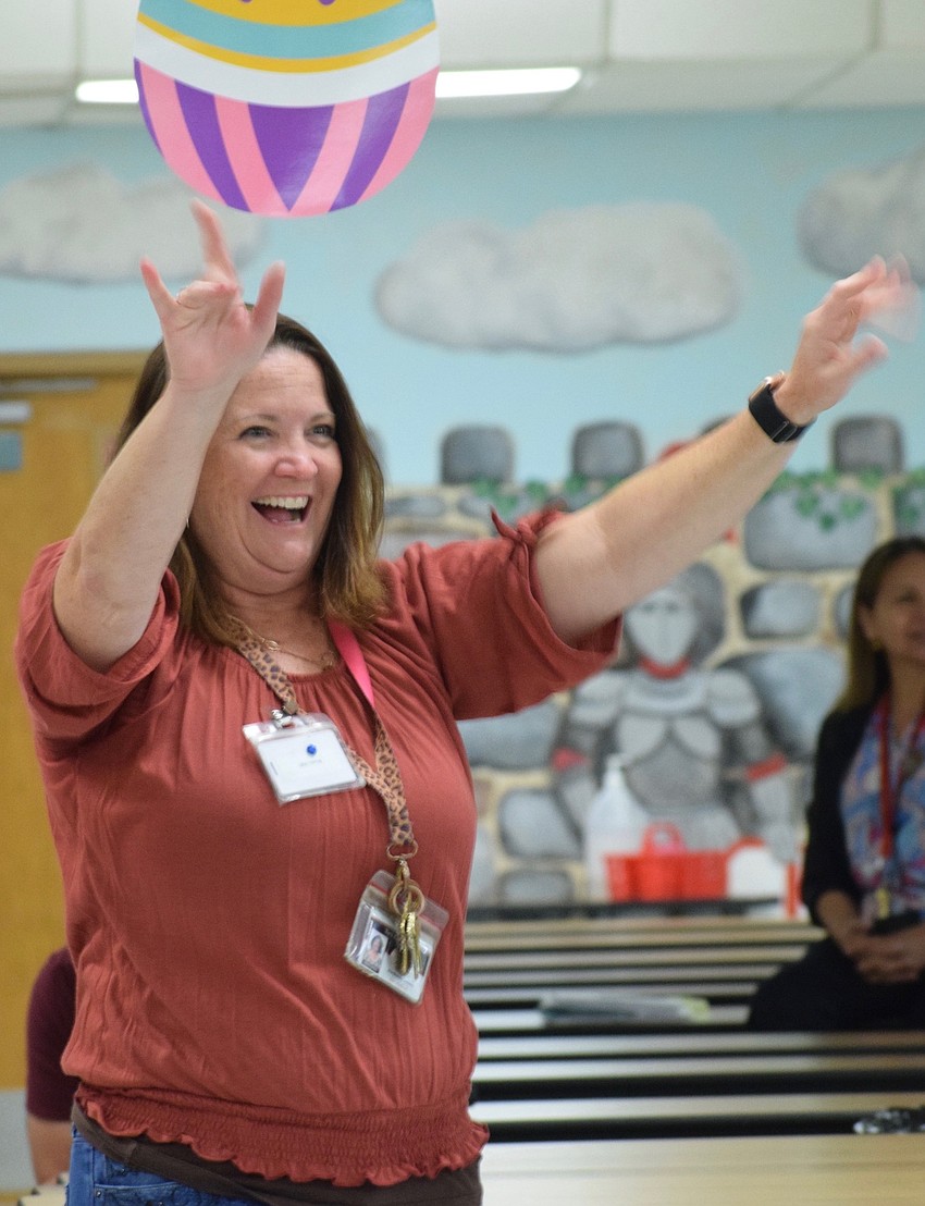 Kimberly Brown, the media specialist, is excited to see Farmer Minor visiting the school.