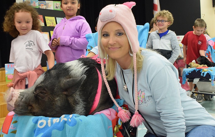 Melissa Hagood, a second grade teacher and big fan of pigs, is thrilled to meet Daisy.