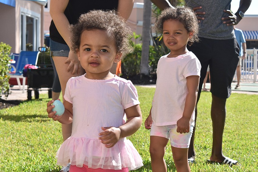 Catherine Owens holds up an egg she found.
