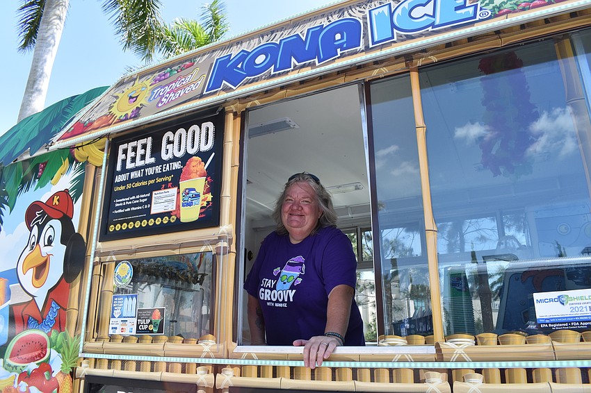 Betsy Megert of Kona Ice offers a way for guests to cool off.