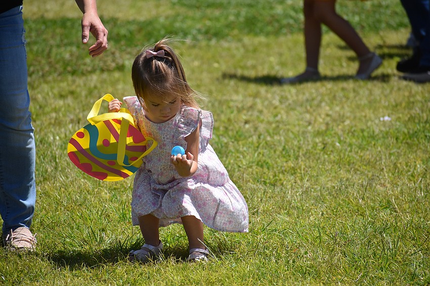 Bradenton's Hallie McCorkle, who is 2, makes a discovery during Eggstravaganza at the Mall at UTC.