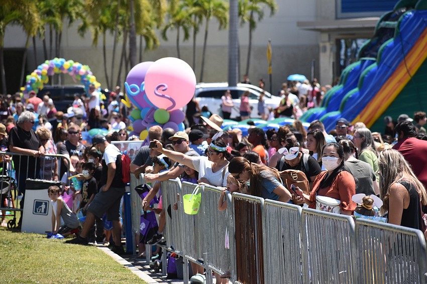 Parents watch as the egg hunt for ages 2-4 begins.