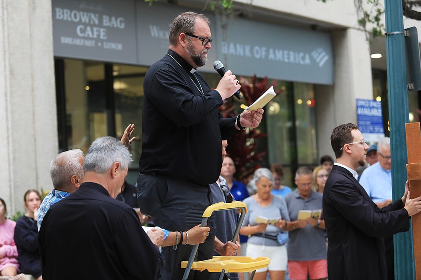 Pastor Jeff Gross speaks at a station.