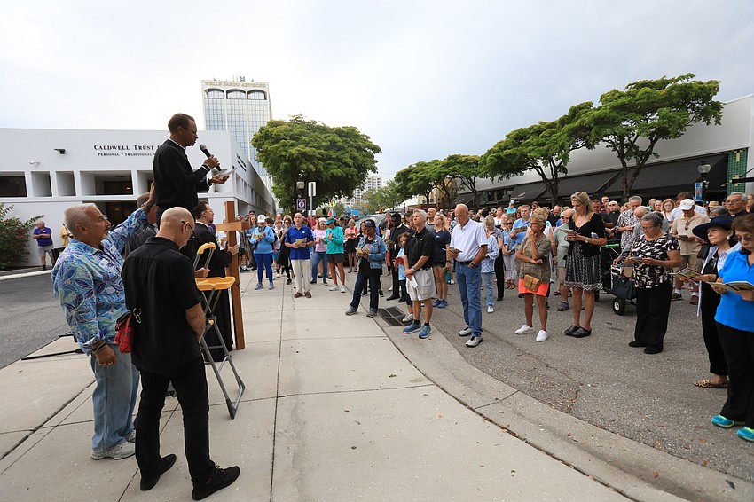 Pastor Peter Greenidge speaks to the crowd.