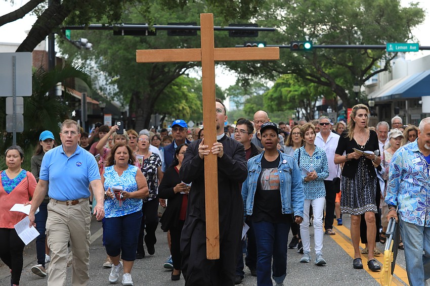 Father David Svihel with the Church of the Redeemer leads the walk.