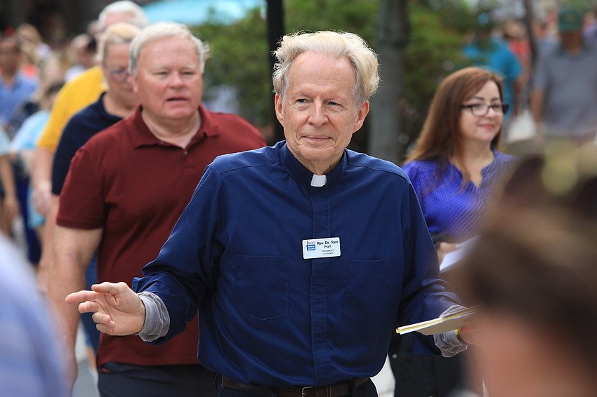 Sarasota Ministerial Association president Tom Pfaff walks with the crowd.
