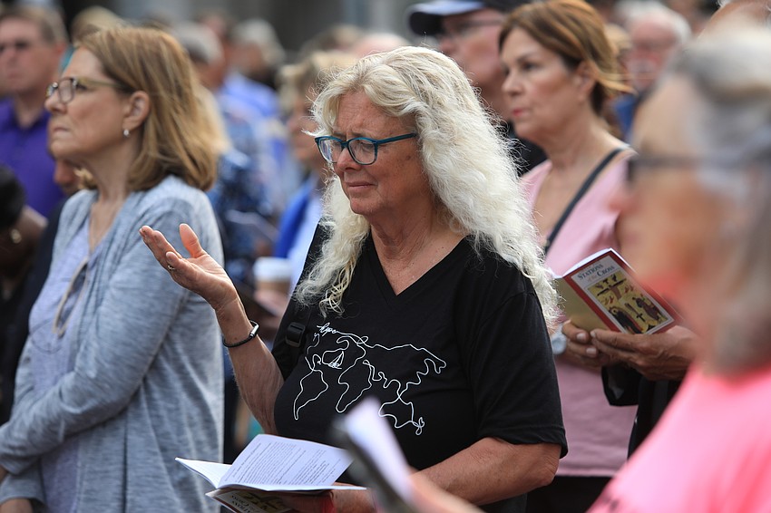 Jan Hamel Solomon prays with the group.
