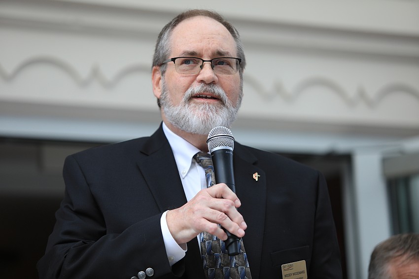 Woody Woodward speaks at a later station.