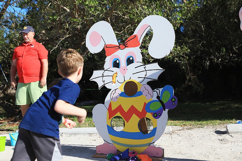 Mason Giunta throws a bean bag.