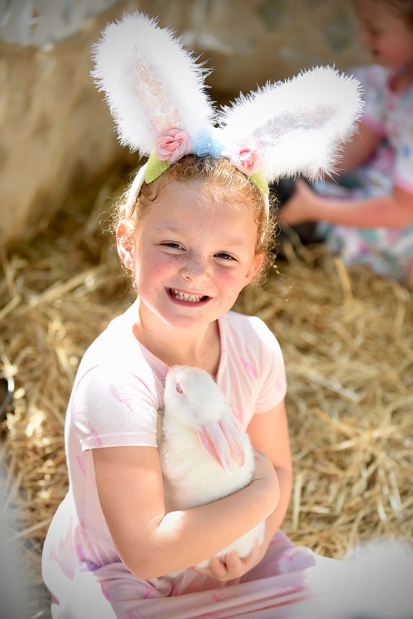 Addison Shea gives a bunny a squeeze.