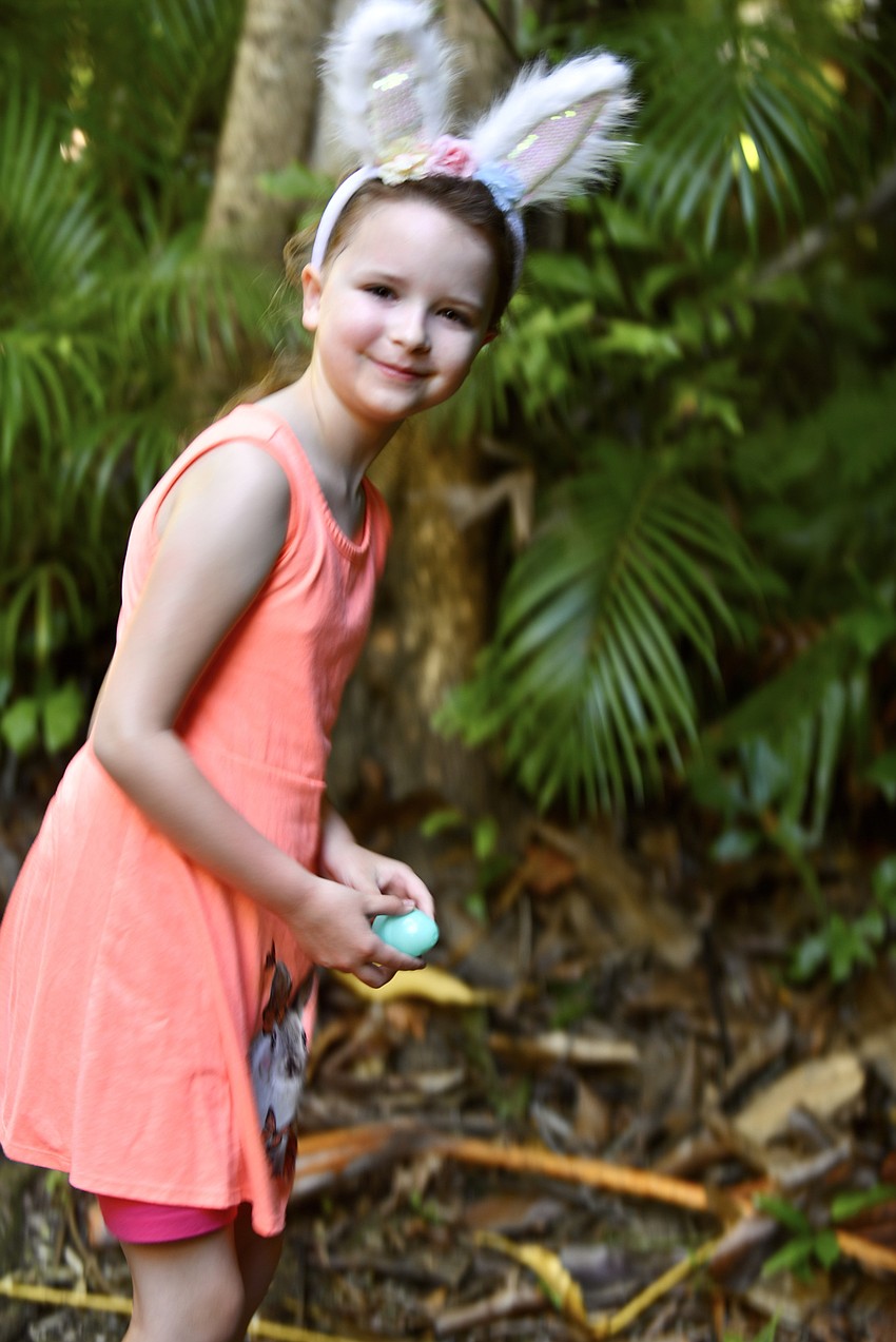 Amelia Winkler collects eggs during the hunt.