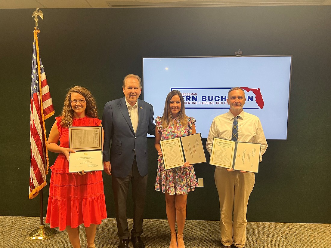 Angelee Gens, left, stands with U.S. Rep. Vern Buchanan and fellow Sarasota County award winners Shannon Nelson and Eric Lostorto.