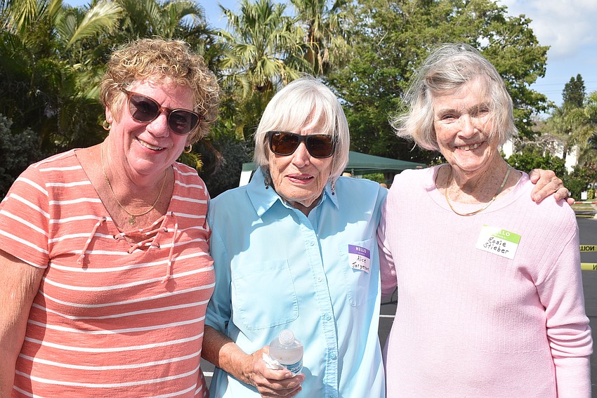 Jeanne Sherwood, Alice Jorgenson and Rosie Stieber head to their picnic setup.