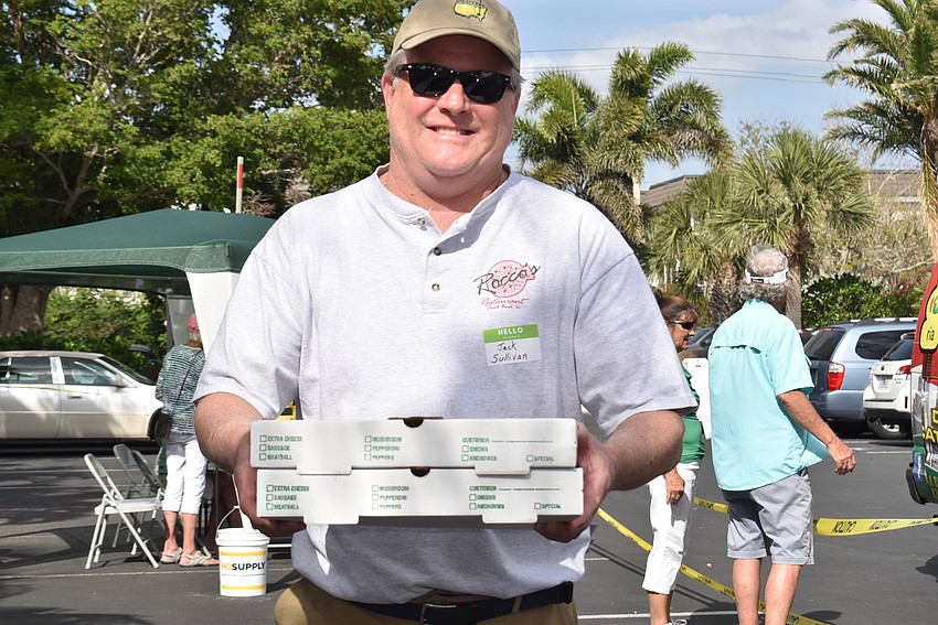 Jack Sullivan unloaded pizza from the van.