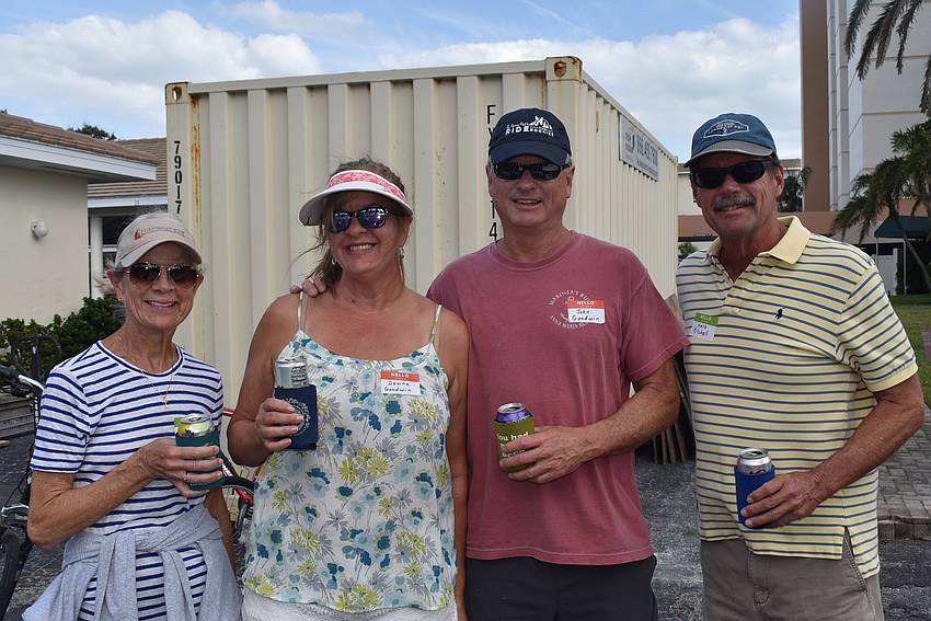 Cindy Ritchell, Dawna Goodwin, Jack Goodwin and Herb Ritchell set up their picnic spot together.