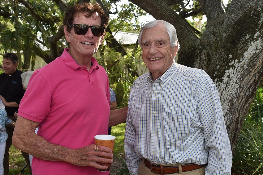 Dave Bishop and Fred Wilson head back to their table.