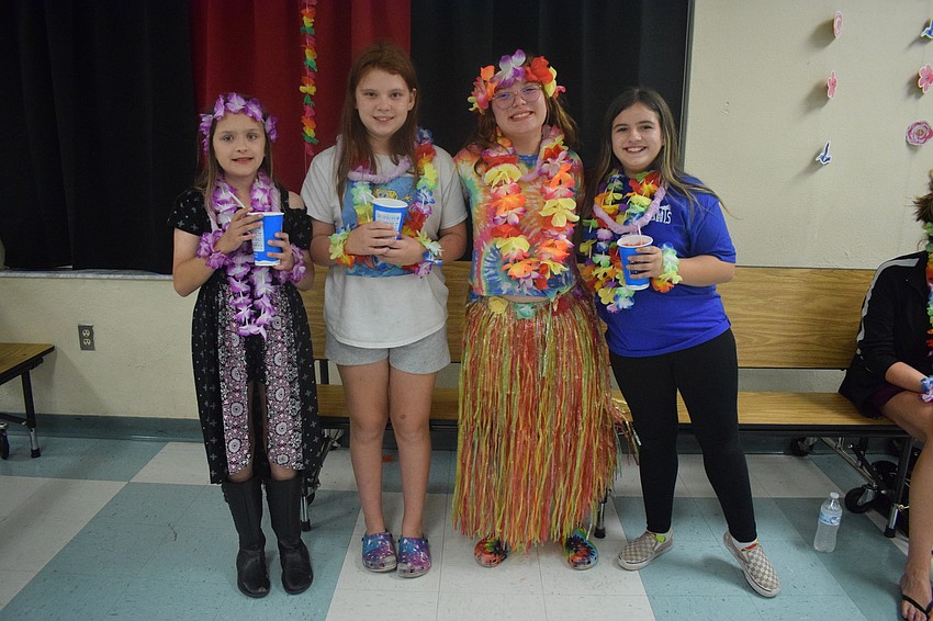 Fifth graders Melanie Atkins, Savannah Alva, Madison Handrich and Kiyanna Leonard enjoy Kona Ice and spending time together.