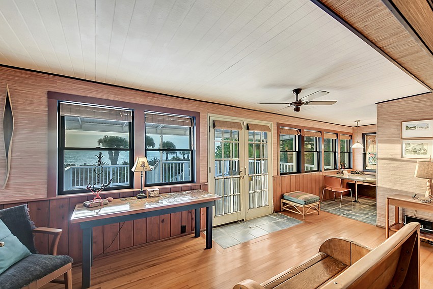 The living space overlooks the porch and the gulfside beach.