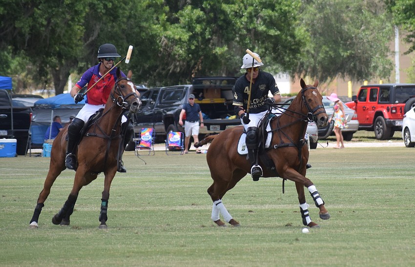Regent's Felipe Viana and Hillcroft's James Miller chase down the ball in the final game of the season at the Sarasota Polo Club.