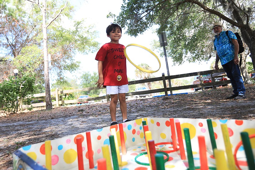 Axl Villanueva plays ring toss.