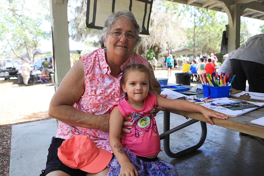 Debbie and Maddie Brown color in the shade.