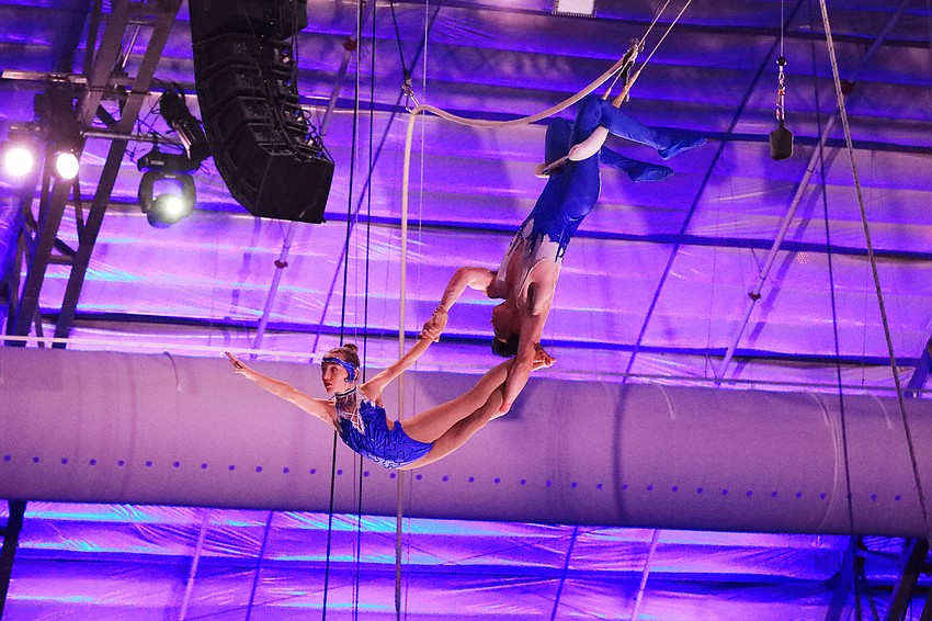 Kaya Burgess and Caleb Gross fly through the air.