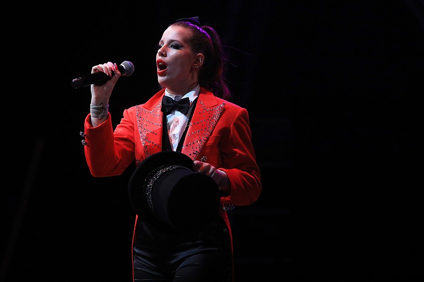 Gabby Barmash welcomes the audience to the show.