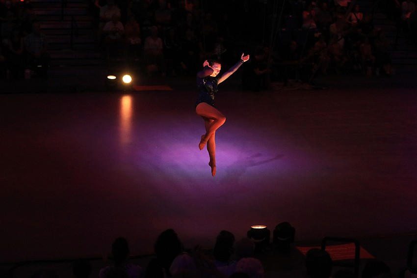 Olivia Miley reaches the ground.