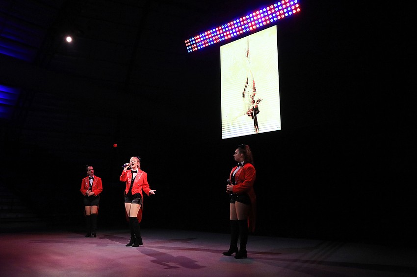 Gabby Barmash welcomes the audience to a new performance.