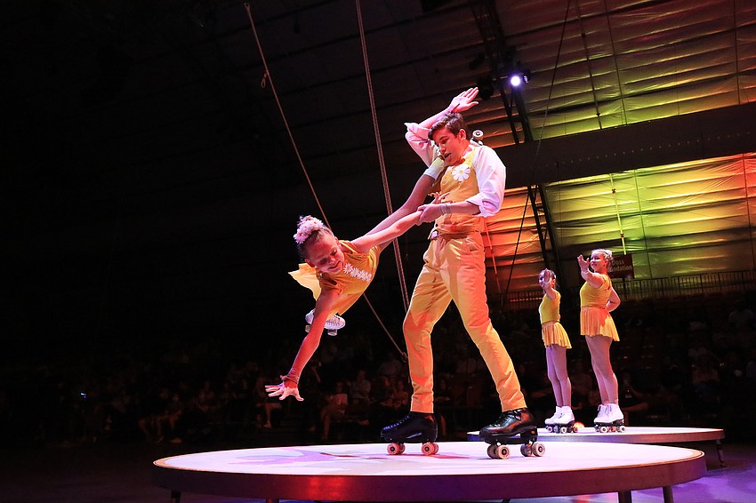 Caleb Overholt swings Annabelle Budslick.