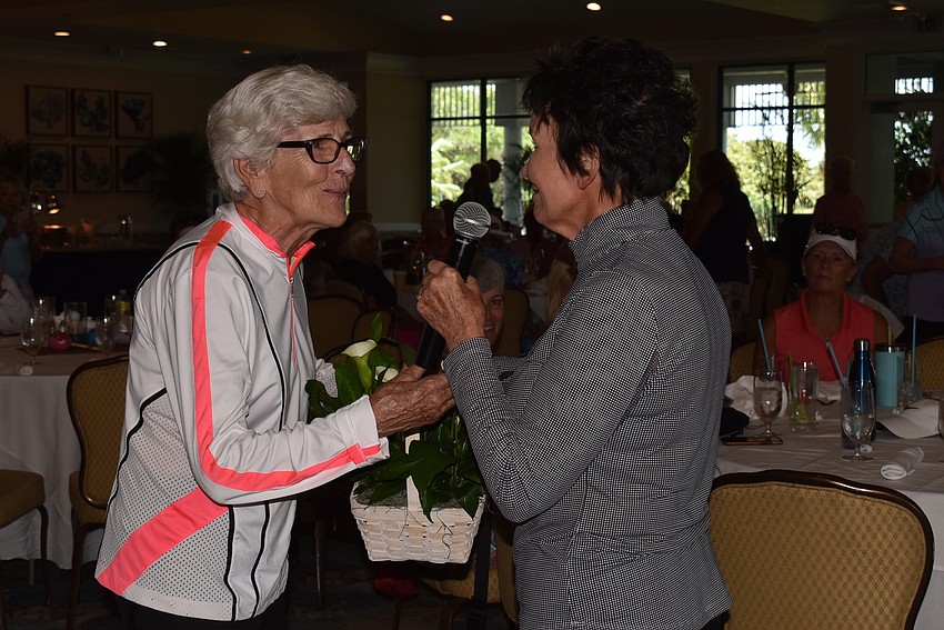 Sylva Langton received a gift from Sandy Finnegan.