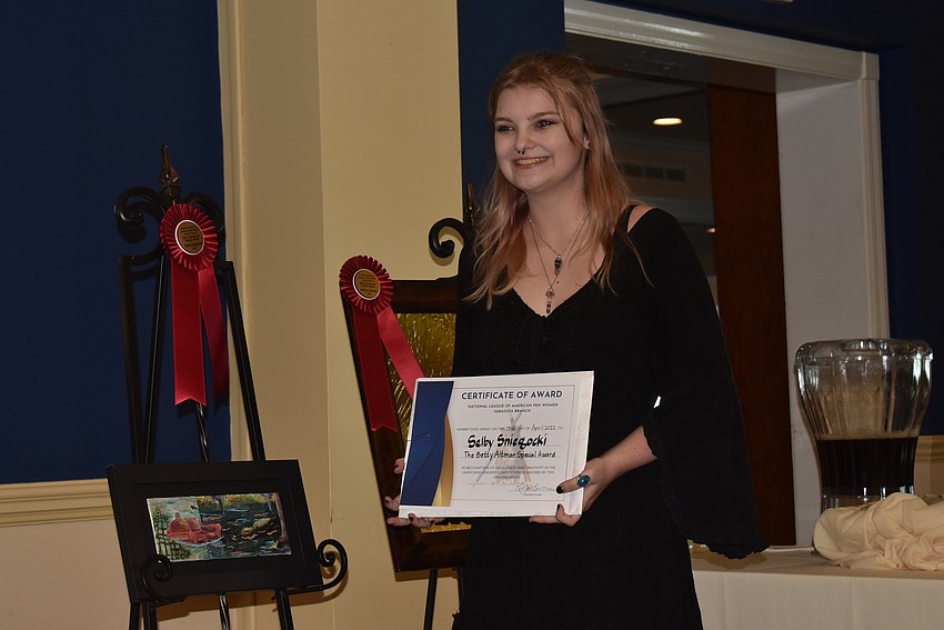 Selby Sniegocki, a student a Booker High School, accepts her award.
