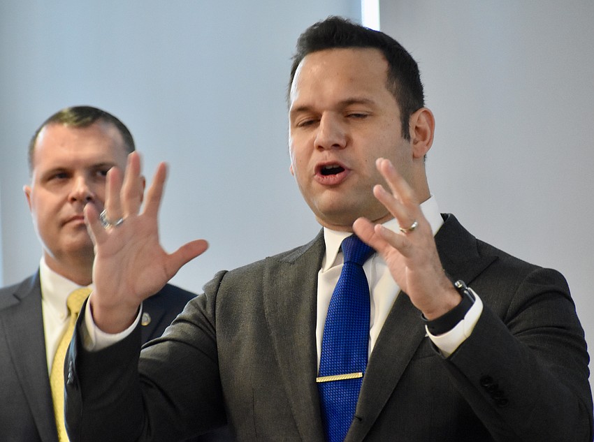 Mayor Erik Arroyo emphasizes a point in his remarks praising the work of Chief Rex Troche in the eight months in which he served as Sarasota Police's interim leader.