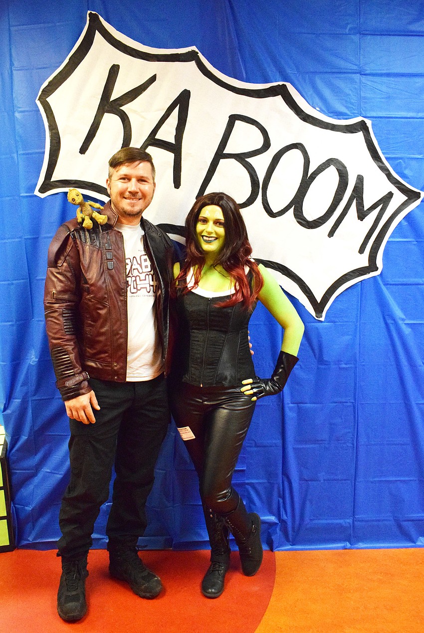 Joseph and Anna Warcewicz surprise their children, first graders John and Aiden, by dressing as Peter Quill and Gamora from Marvel's 