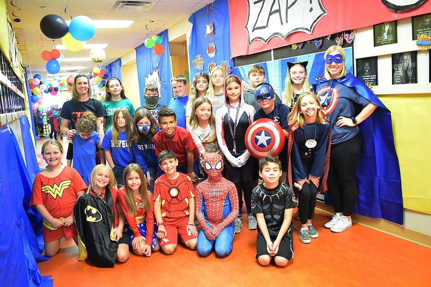 Fourth grade teacher Whitney McElhiney and her class celebrate Superhero Day at Braden River Elementary School.