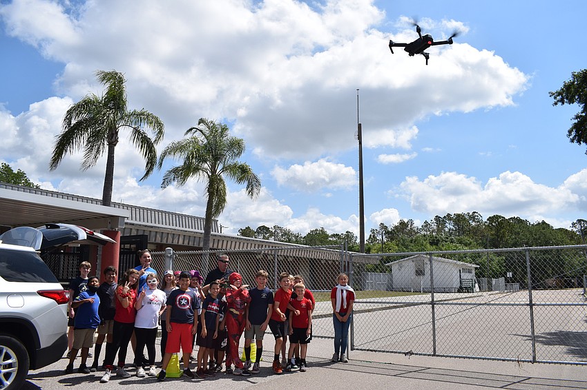 Detective Jon Feverston takes a class photos using a drone.