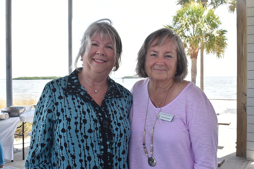 Kathy Ruscitto and JoAnn Schwencke finalized the picnic setup.