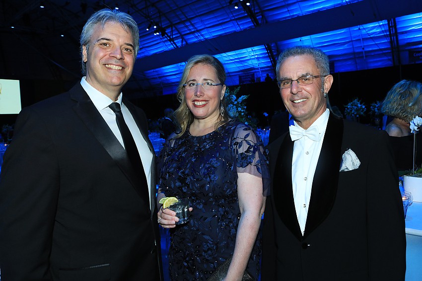 Rob and Jennifer Rominiecki with Kelvin Cooper