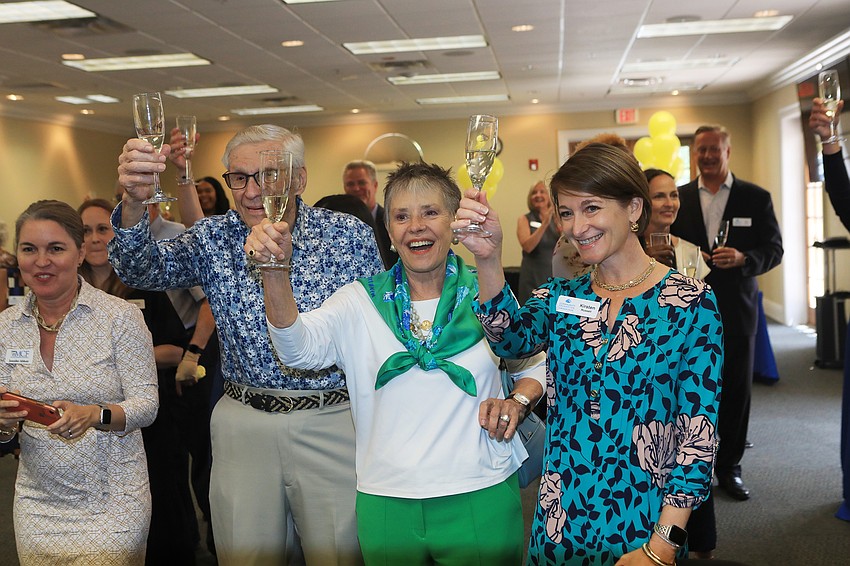 The crowd toasted in celebration.