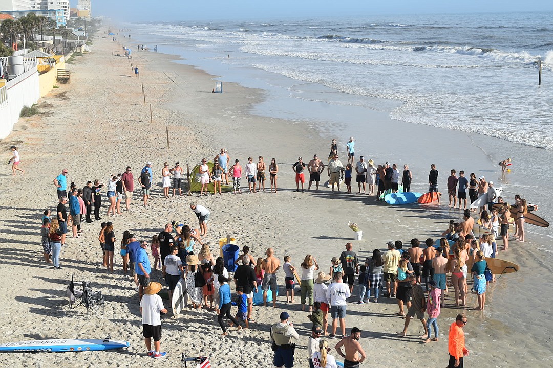 'He lives on in the better parts of us': Paddle-out ceremony held for ...