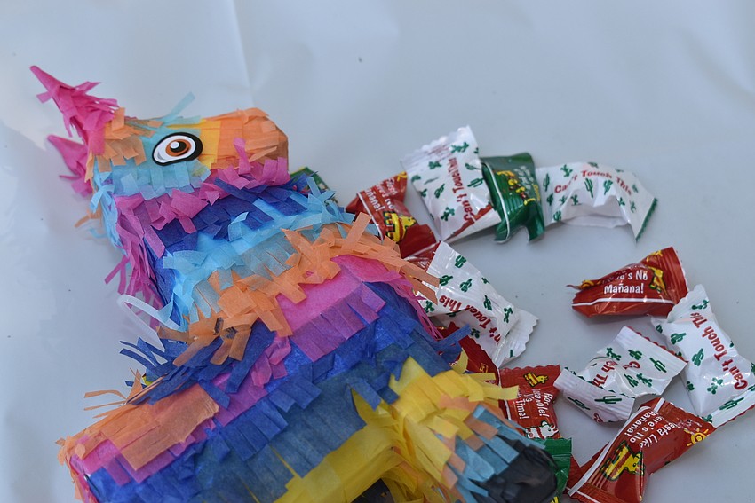 The tables were decorated with tiny piñatas.