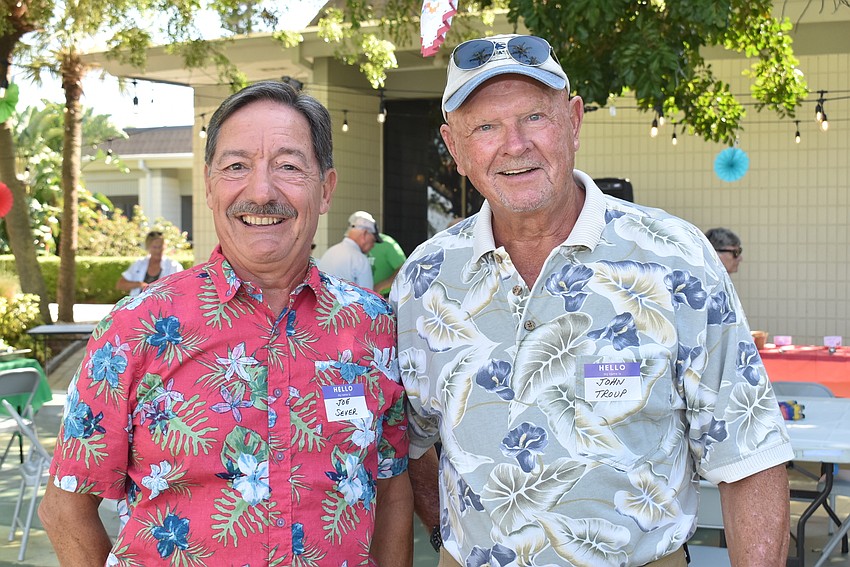 Joe Sever and John Troup catch up at the party.