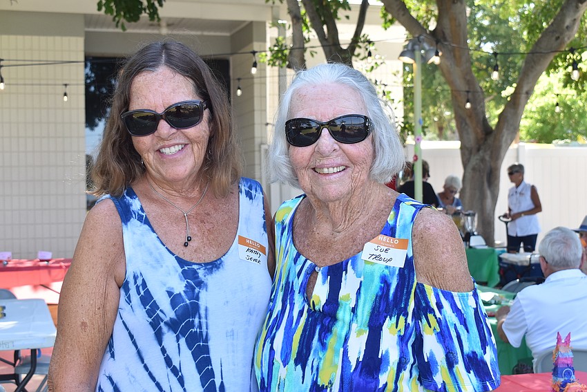 Kathy Sever and Sue Troup match at the party.