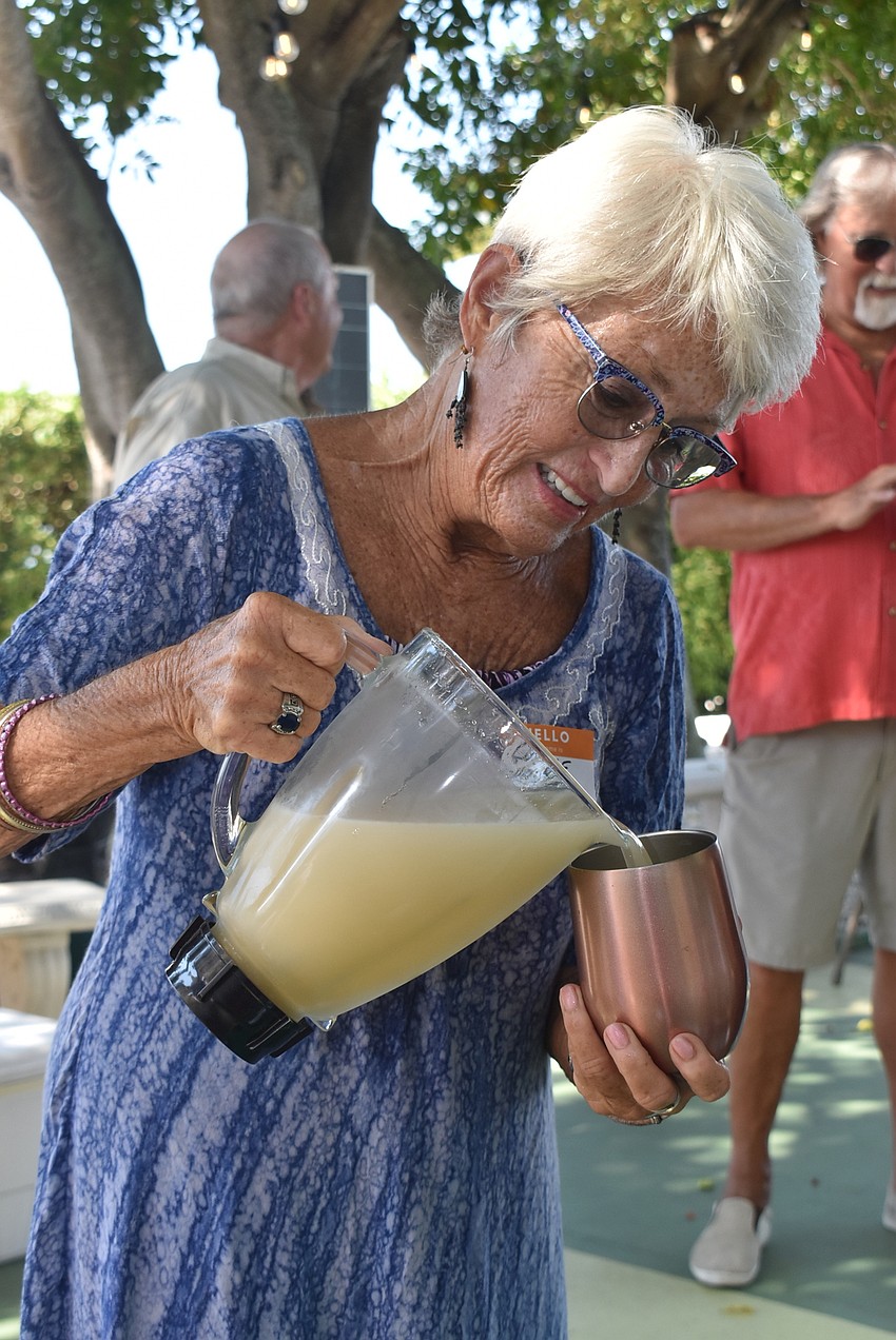 Connie Haubert pours frozen margaritas.