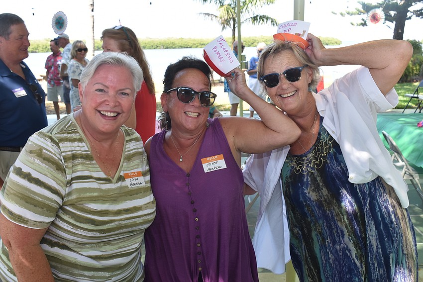 Linda Beekman with Joyce Hecklau and Linda DiOrio and their festive hats.